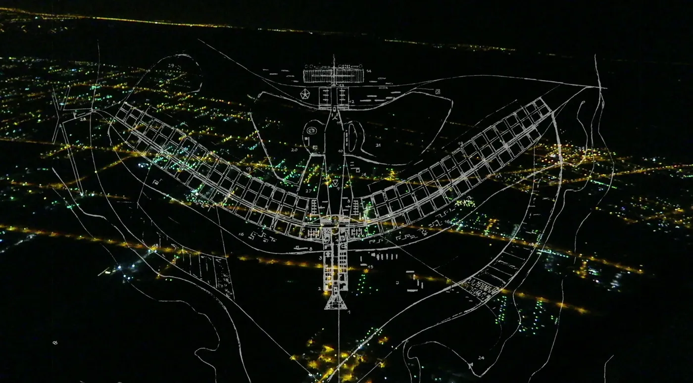 Lúcio Costa's plan of Brasília drawn over the lights of the city at night